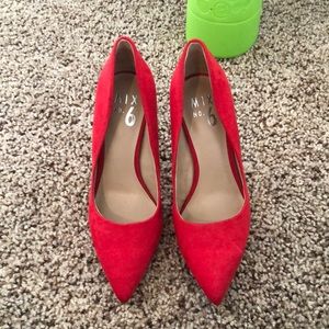 Red suede pumps